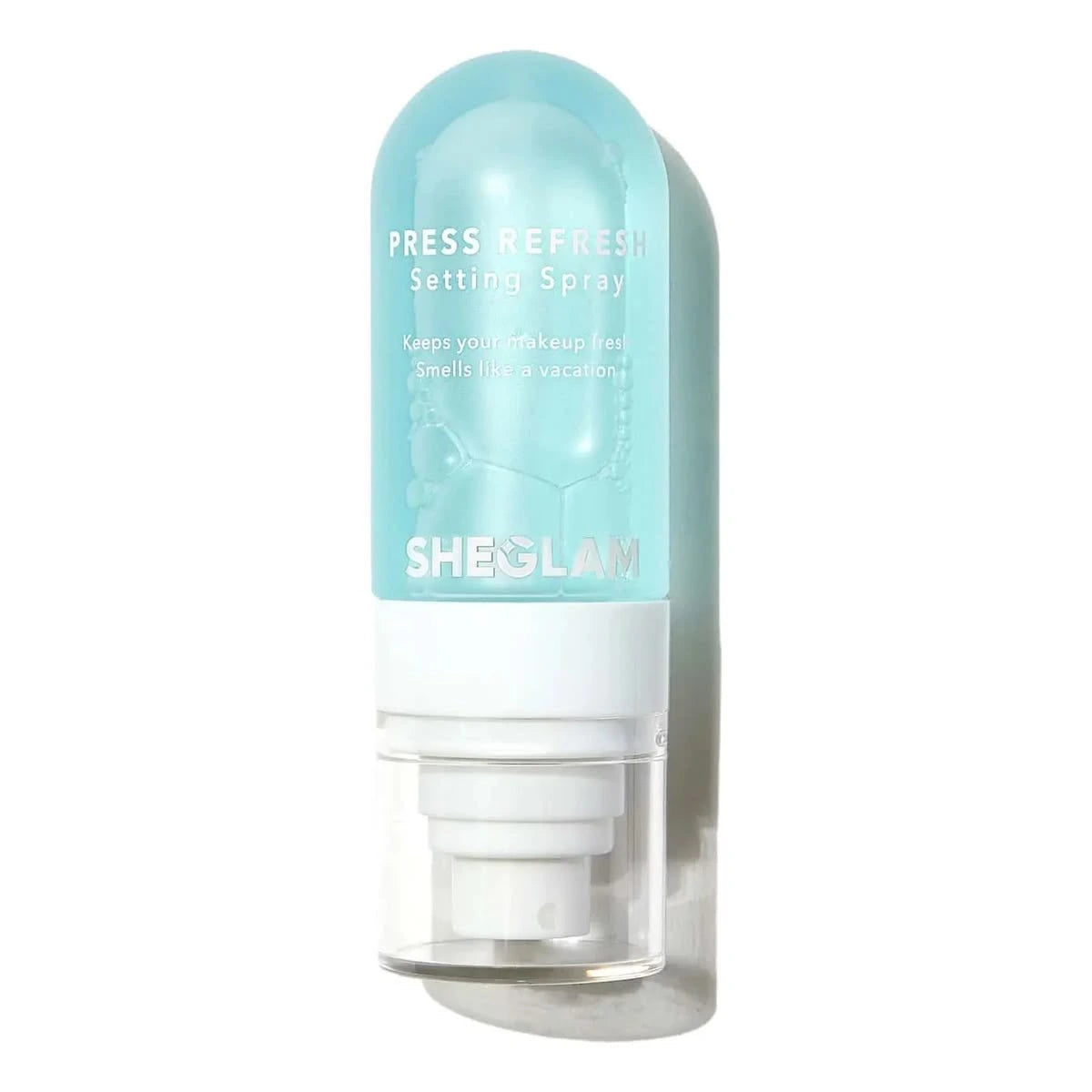 Sheglam Press Refresh Setting Spray in a translucent light blue bottle with a white pump dispenser, shown against a plain white background.